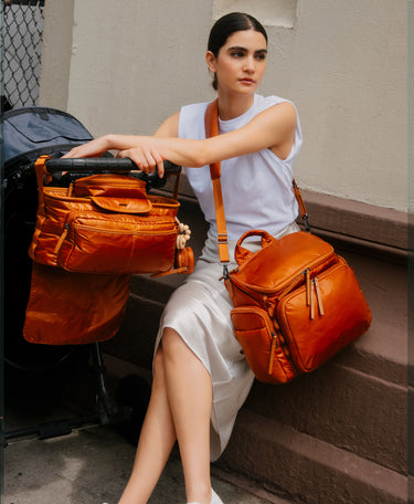 Model sitting with Baby Bag and Stroller Caddy in Clay