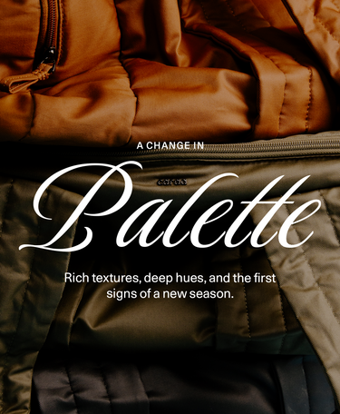 A close-up promotional image of a quilted jacket showing a color palette transition from warm camel brown at the top to deep olive green and black at the bottom, overlaid with white text reading 'A CHANGE IN Palette' and 'Rich textures, deep hues, and the first signs of a new season.'.