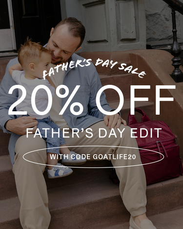 Man holding a child on a staircase with Father's Day sale text overlay