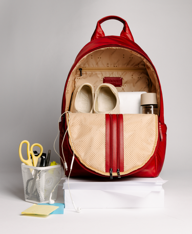Stratus in Red Dahlia open with shoes, laptop and water bottle inside